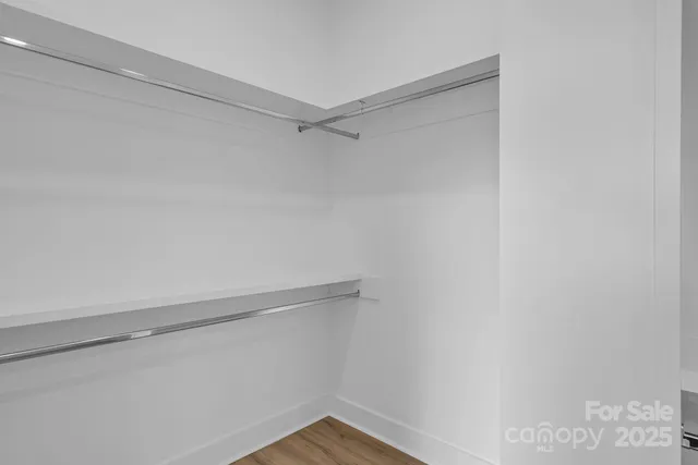 a view of an empty walk in closet