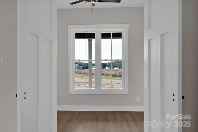 a view of empty room with windows