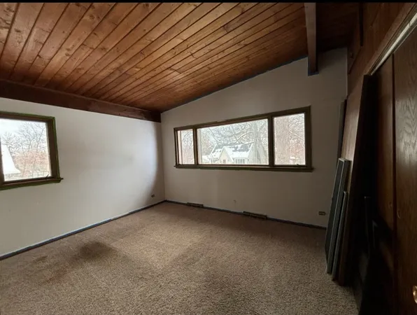 a view of a room that has a large window
