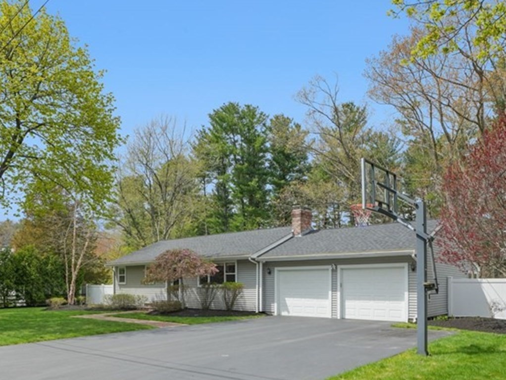 32 Red Barn Road Wayland, MA 01778 - Photo 2 of 27 a view of a white house next to a yard with big trees