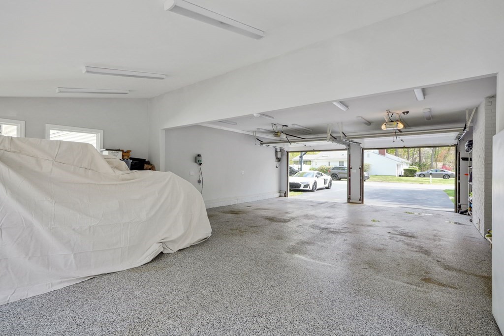 32 Red Barn Road Wayland, MA 01778 - Photo 25 of 27 a spacious bedroom with a bed and a large window