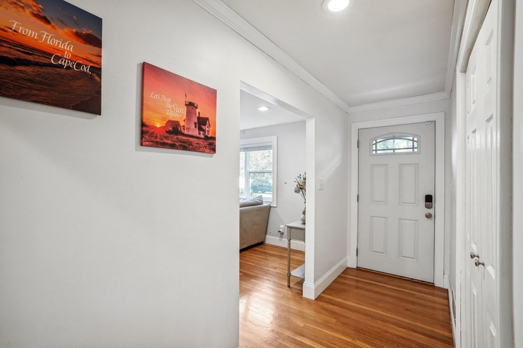 32 Red Barn Road Wayland, MA 01778 - Photo 3 of 27 a view of a hallway with wooden floor and closet