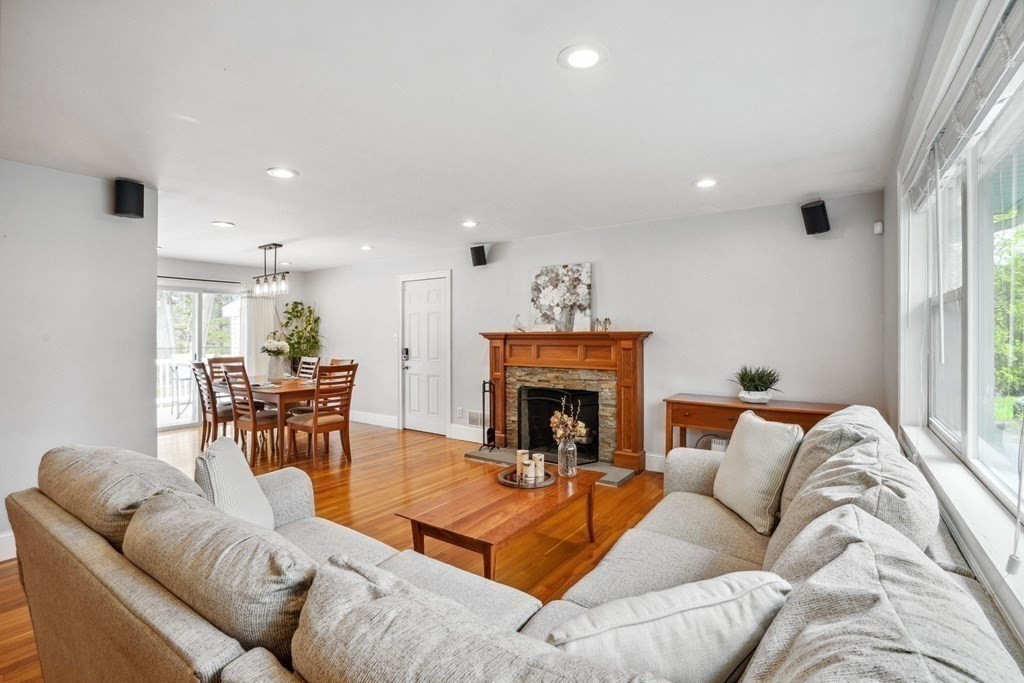 32 Red Barn Road Wayland, MA 01778 - Photo 4 of 27 a living room with furniture and a fireplace