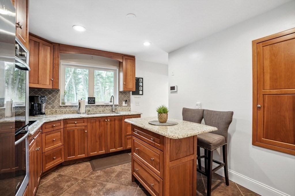 32 Red Barn Road Wayland, MA 01778 - Photo 10 of 27 a kitchen with a sink refrigerator and cabinets