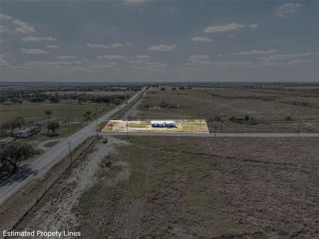 a hallway with a view of nearby houses