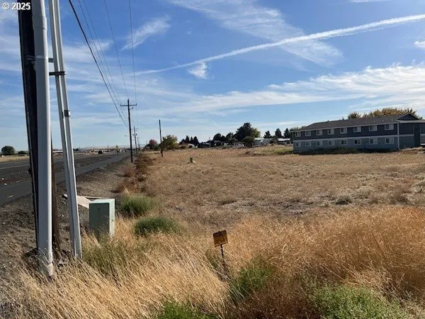 a view of a large body of water with a building in the background