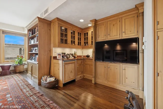 a view of a livingroom with furniture and an entryway