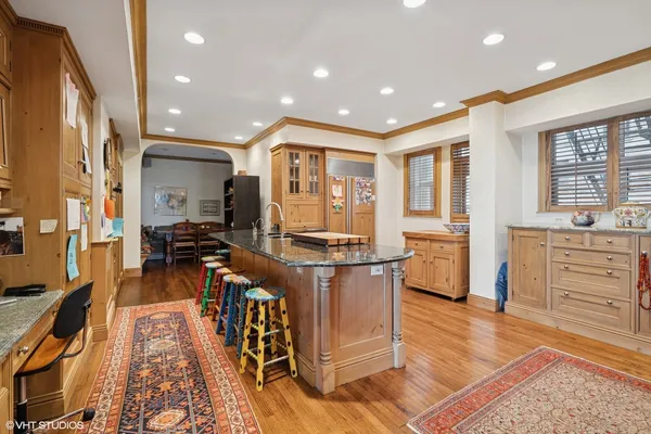 a kitchen with stainless steel appliances granite countertop a stove and a refrigerator
