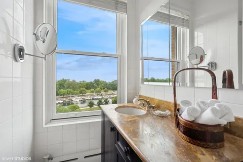 a bedroom with bed couch and window