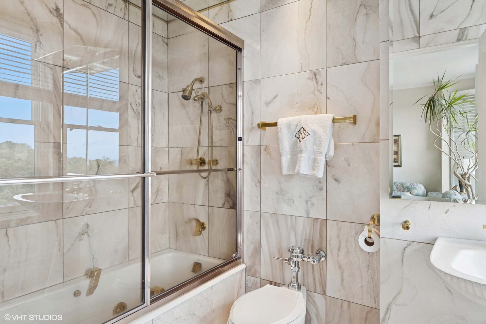 3500 North Lake Shore Drive, Unit 7C Chicago, IL 60657 - Photo 31 of 36 a bathroom with a shower and toilet