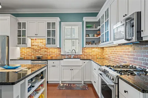 a living room with furniture a window and a table