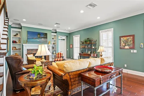 a bathroom with a granite countertop tub sink and mirror