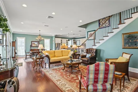 a view of a hallway with furniture and front door