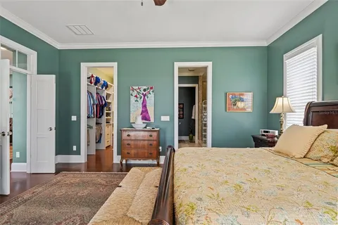 a living room with lots of furniture and a book shelf