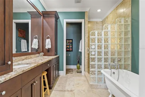 a living room with furniture and a book shelf