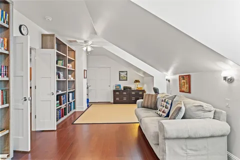 an aerial view of a city with lake view in back