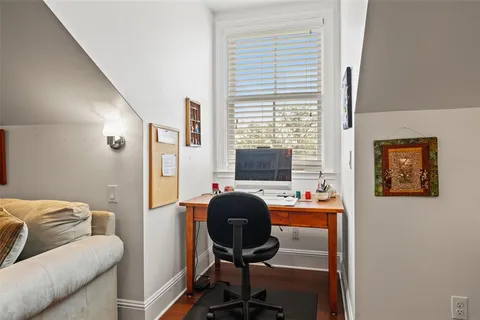 an aerial view of a house with a lake view