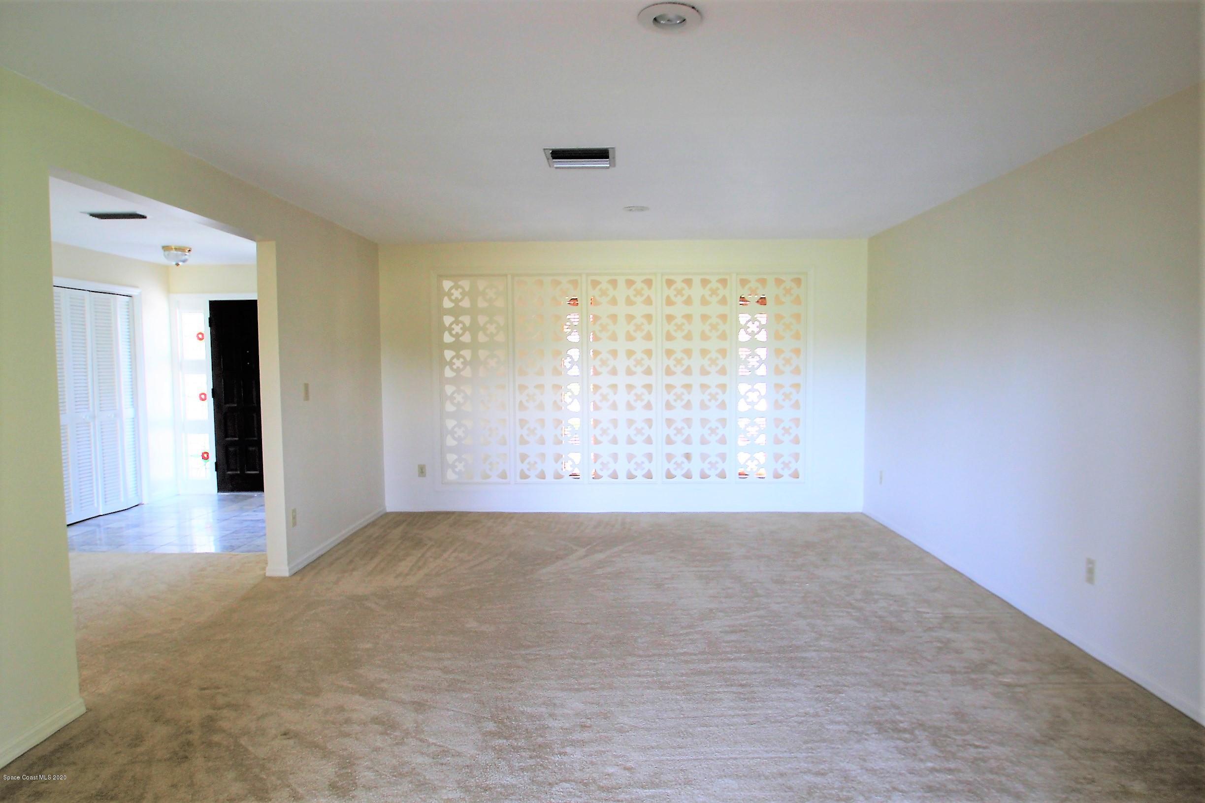 790 Montclair Road Northeast Palm Bay, FL 32905 - Photo 11 of 38 Formal Living Room
