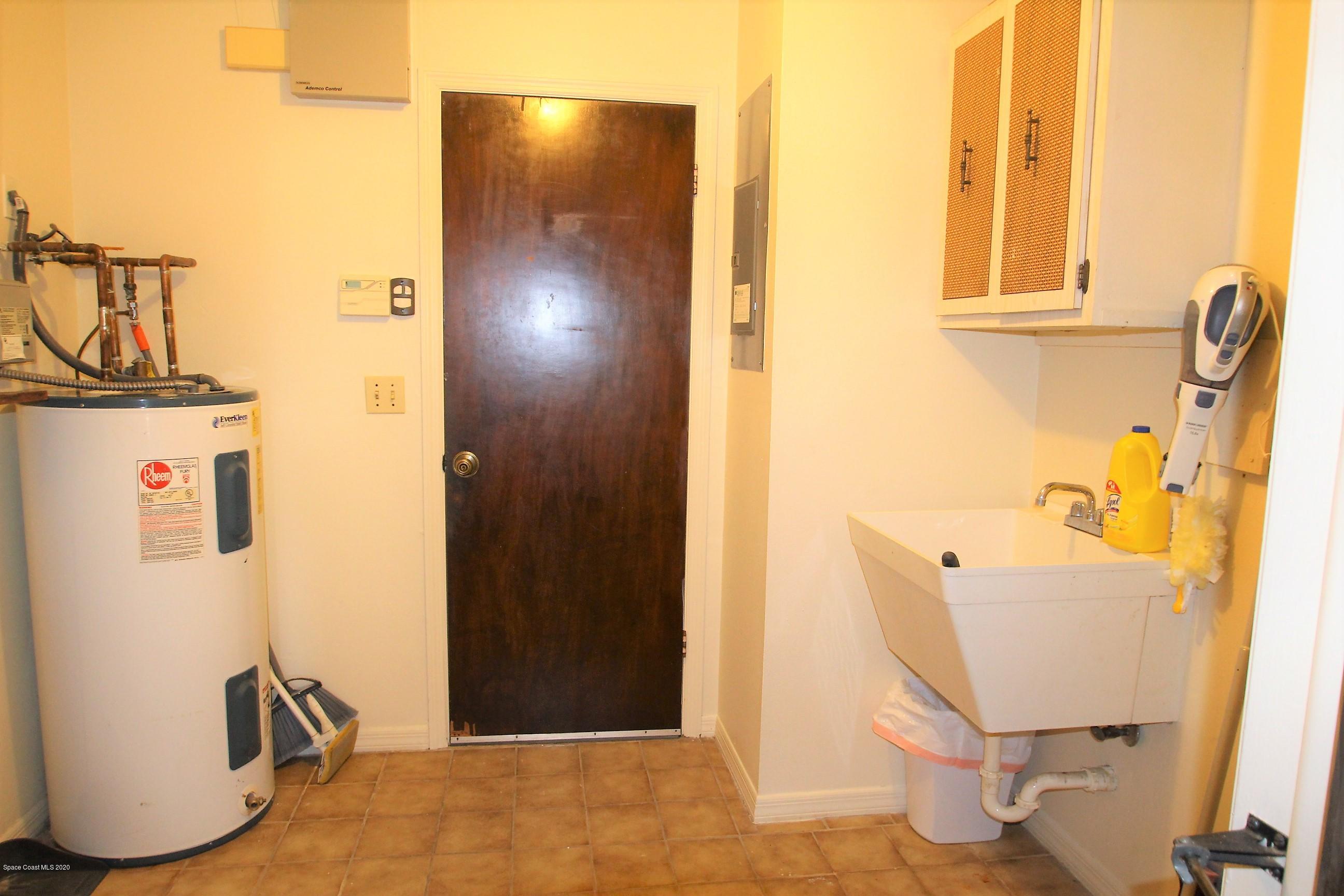 790 Montclair Road Northeast Palm Bay, FL 32905 - Photo 34 of 38 Inside Laundry Room