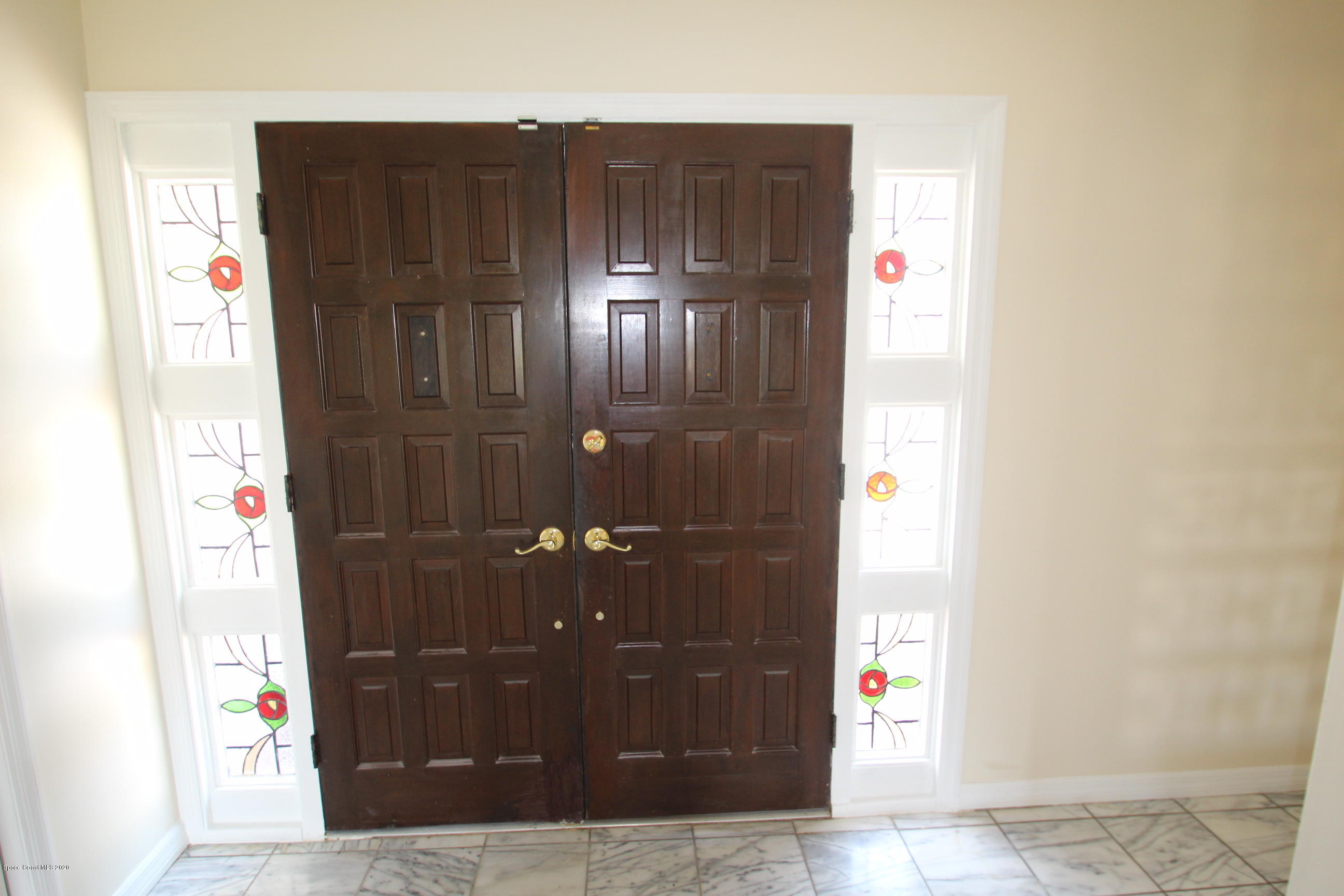 790 Montclair Road Northeast Palm Bay, FL 32905 - Photo 9 of 38 Foyer Double Doors