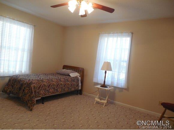 528 Buckner Branch Road Bryson City, NC 28713 - Photo 14 of 20 a bedroom with a bed and a window
