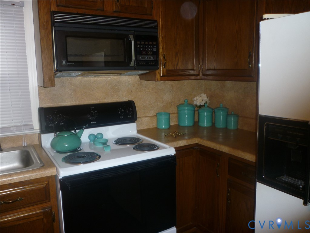 1645 Manakin Road Manakin-Sabot, VA 23103 - Photo 2 of 6 a kitchen with a sink stove and microwave
