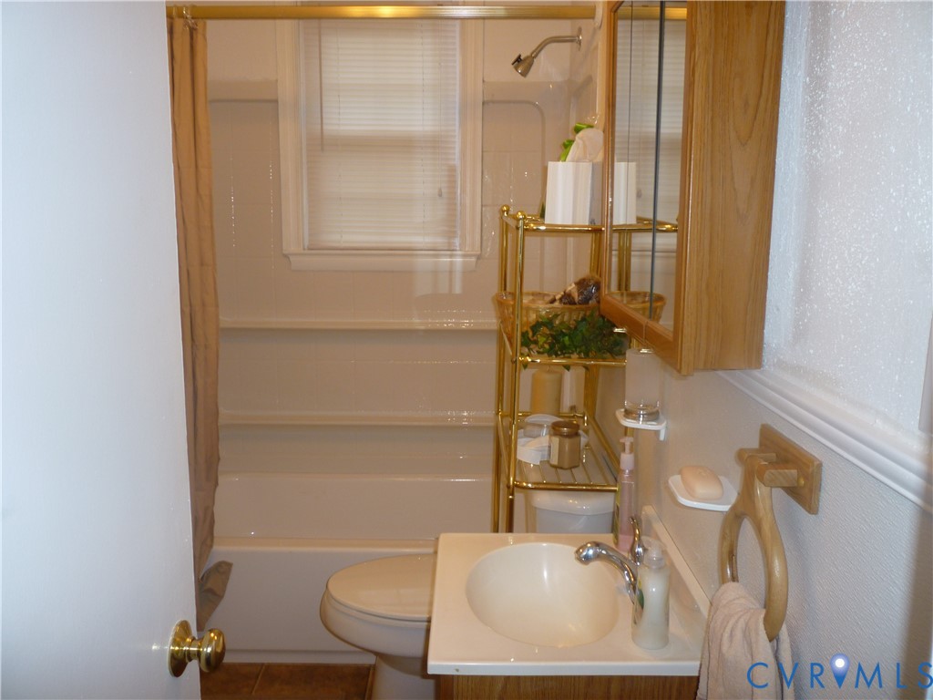 1645 Manakin Road Manakin-Sabot, VA 23103 - Photo 4 of 6 a bathroom with a sink and a mirror