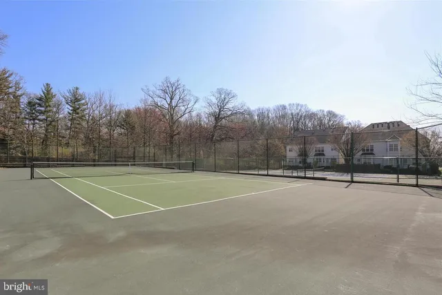 a picture of a bench in front of a wall