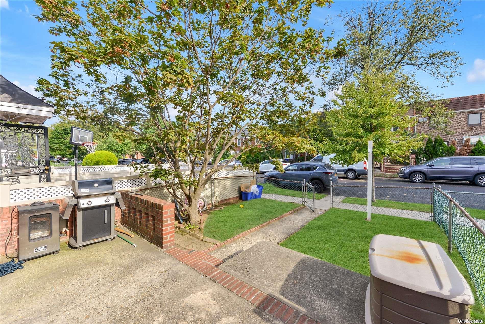 144-31 69th Road Queens, NY 11367 - Photo 21 of 21 a view of a backyard with sitting area