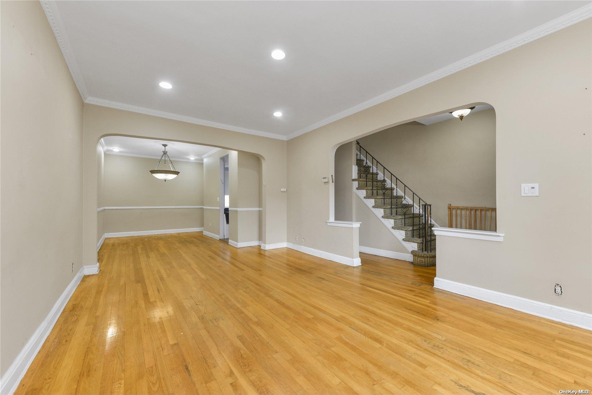 144-31 69th Road Queens, NY 11367 - Photo 3 of 21 a view of empty room with wooden floor