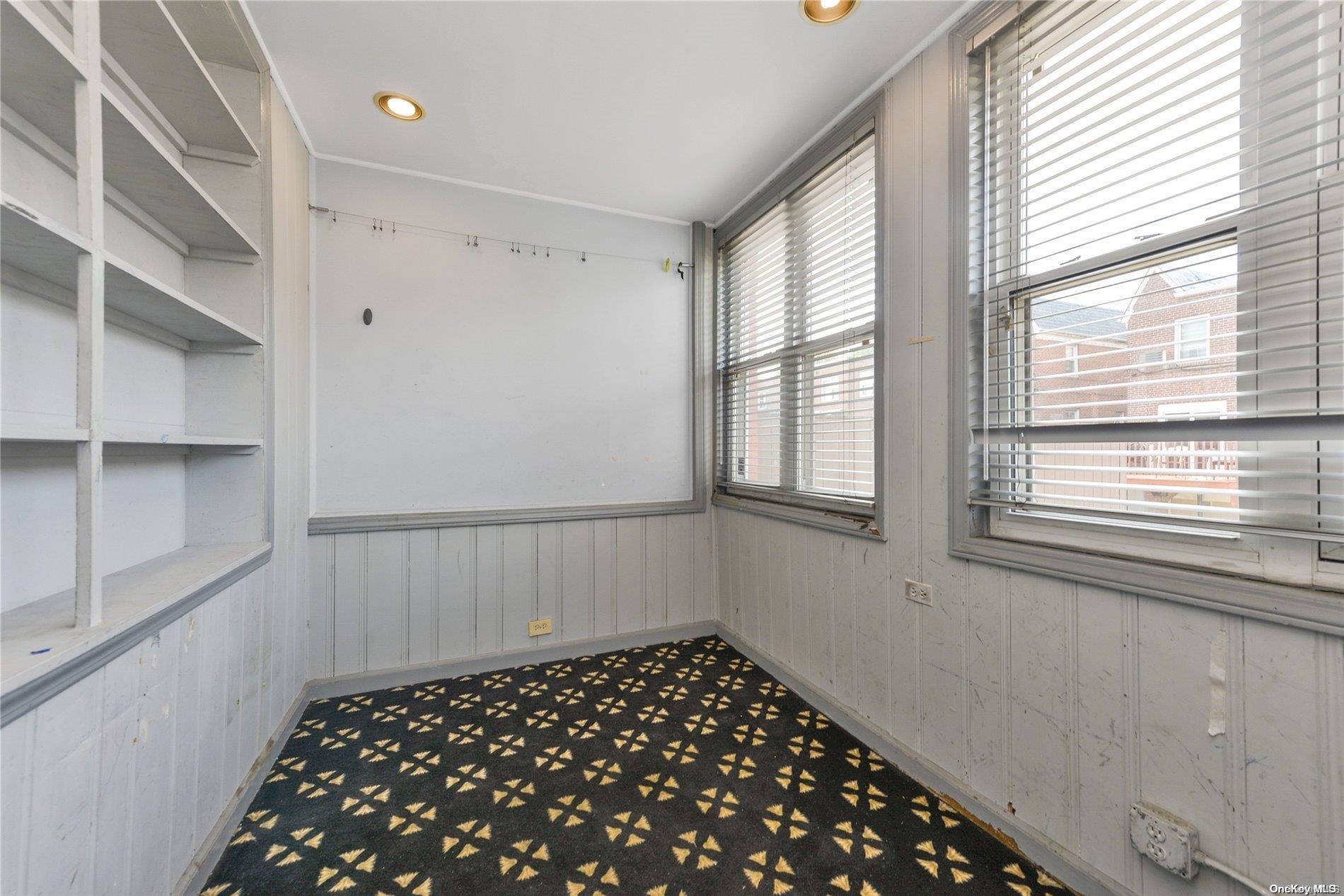 144-31 69th Road Queens, NY 11367 - Photo 9 of 21 a bathroom with a black white checkered floor with a sink