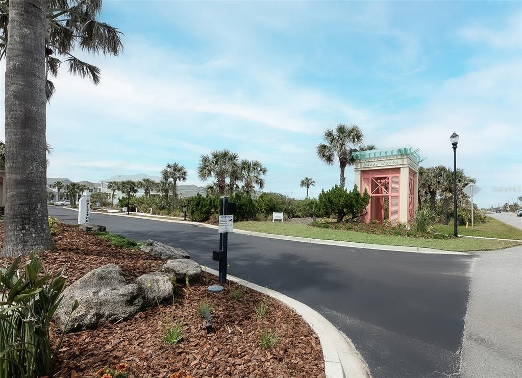 24 Sandy Beach Way Palm Coast, FL 32137 - Photo 14 of 17 a view of a house with a yard and a garage