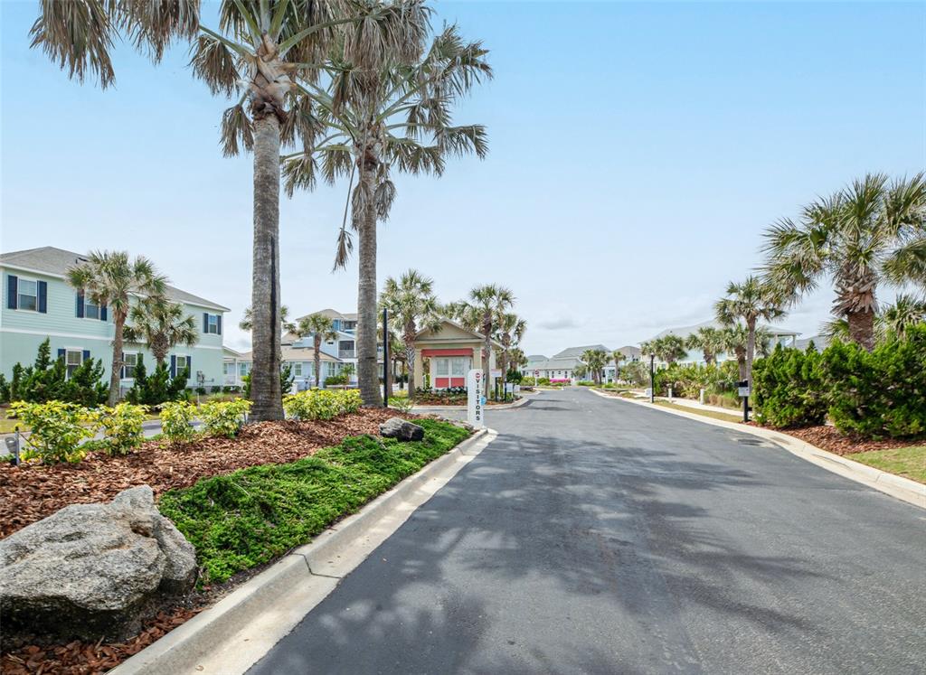 24 Sandy Beach Way Palm Coast, FL 32137 - Photo 16 of 17 a road with view of tall trees