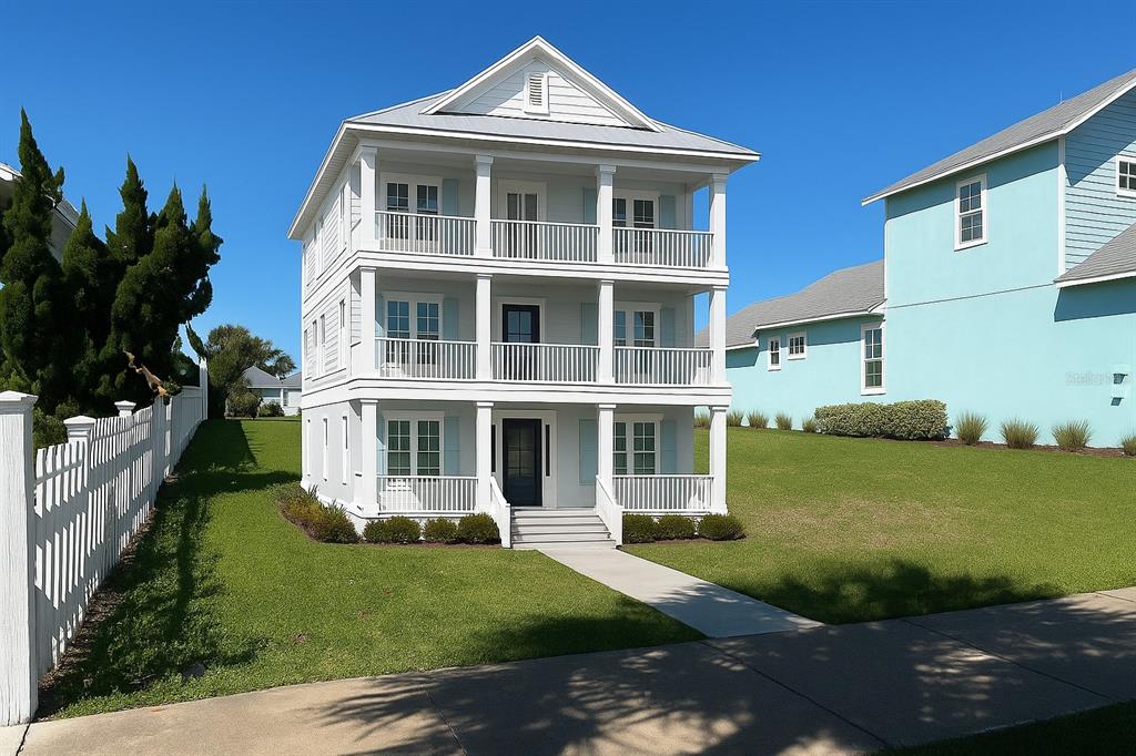 24 Sandy Beach Way Palm Coast, FL 32137 - Photo 6 of 17 a front view of a house with a yard