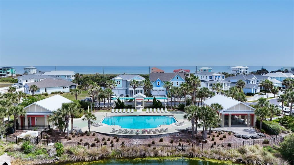 24 Sandy Beach Way Palm Coast, FL 32137 - Photo 10 of 17 a view of a house with a swimming pool