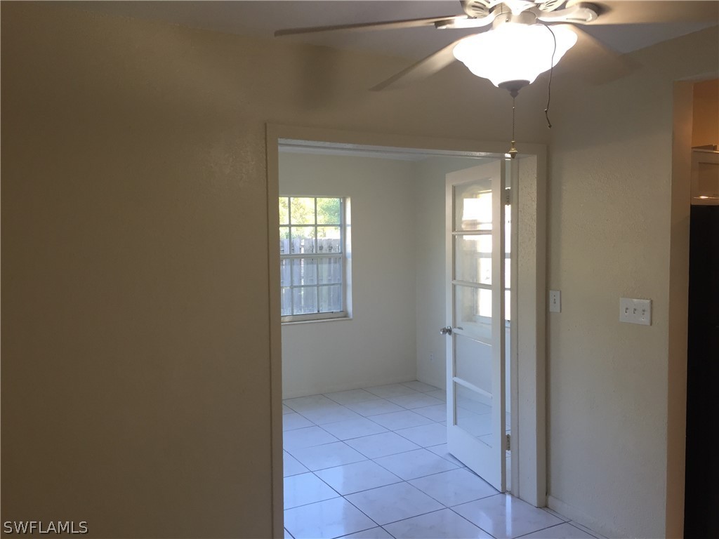 1545 Ransom Street Fort Myers, FL 33901 - Photo 19 of 25 a view of an empty room with window and wooden floor