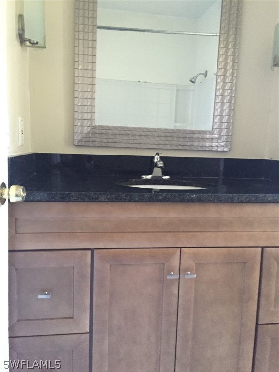 1545 Ransom Street Fort Myers, FL 33901 - Photo 21 of 25 a bathroom with a sink and a mirror
