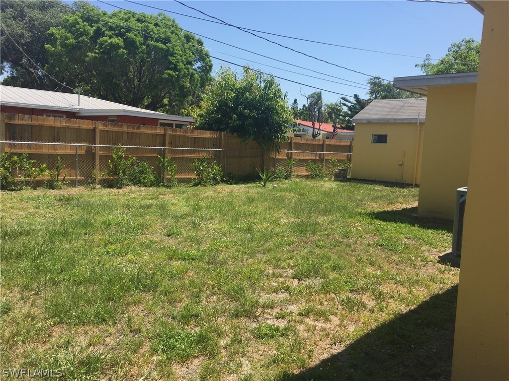 1545 Ransom Street Fort Myers, FL 33901 - Photo 5 of 25 a backyard of a house with lots of green space