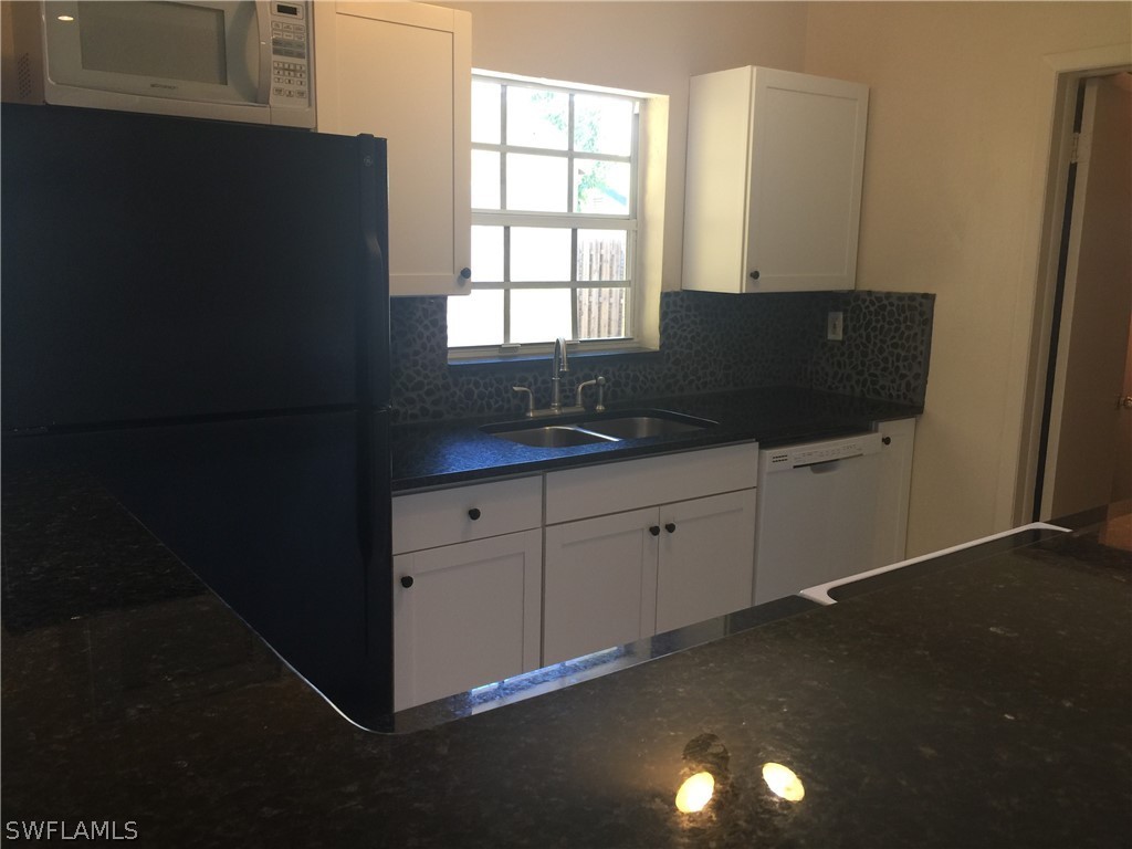 1545 Ransom Street Fort Myers, FL 33901 - Photo 10 of 25 a kitchen with a sink and a window