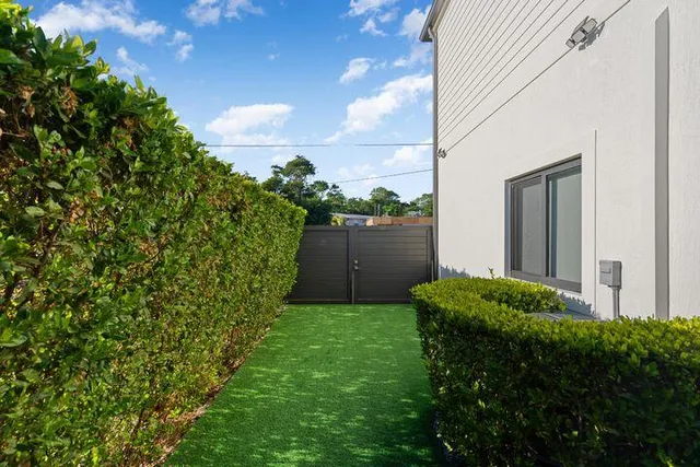 a backyard of a house with lots of green space