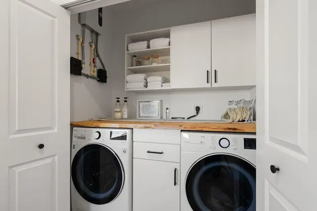 a view of kitchen sink and washer dryer