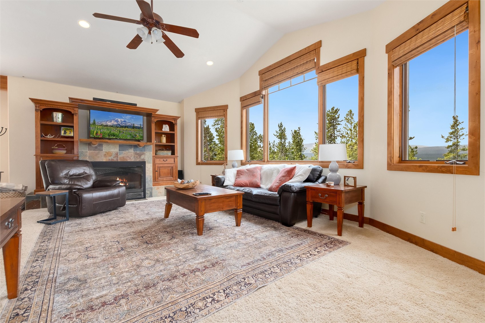 592 Ponderosa Road Fairplay, CO 80440 - Photo 9 of 45 a living room with furniture a fireplace and a flat screen tv