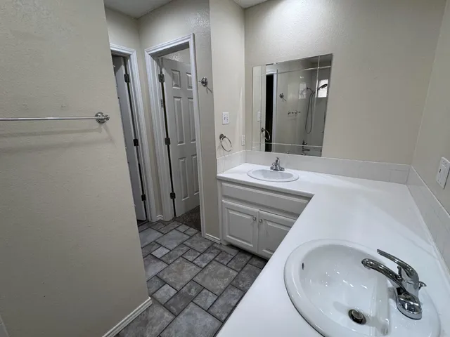 a bathroom with a sink and a mirror