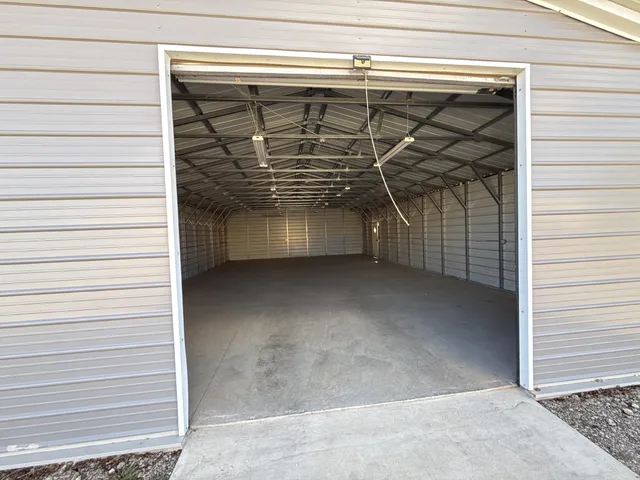 a view of a room with a door and a window