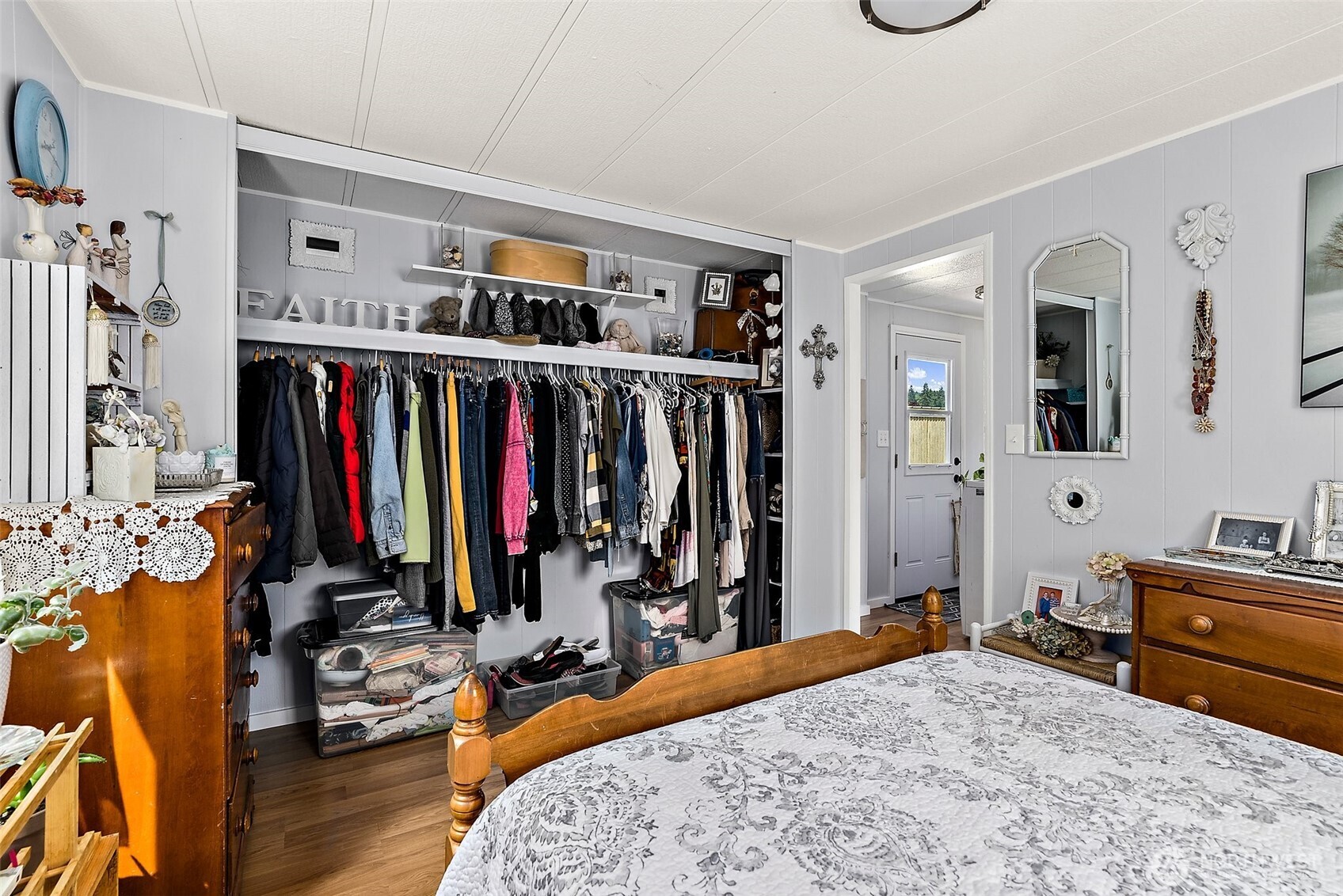 1050 Howard Street, Unit 9 Raymond, WA 98577 - Photo 12 of 20 a bed room with a bed and a mirror