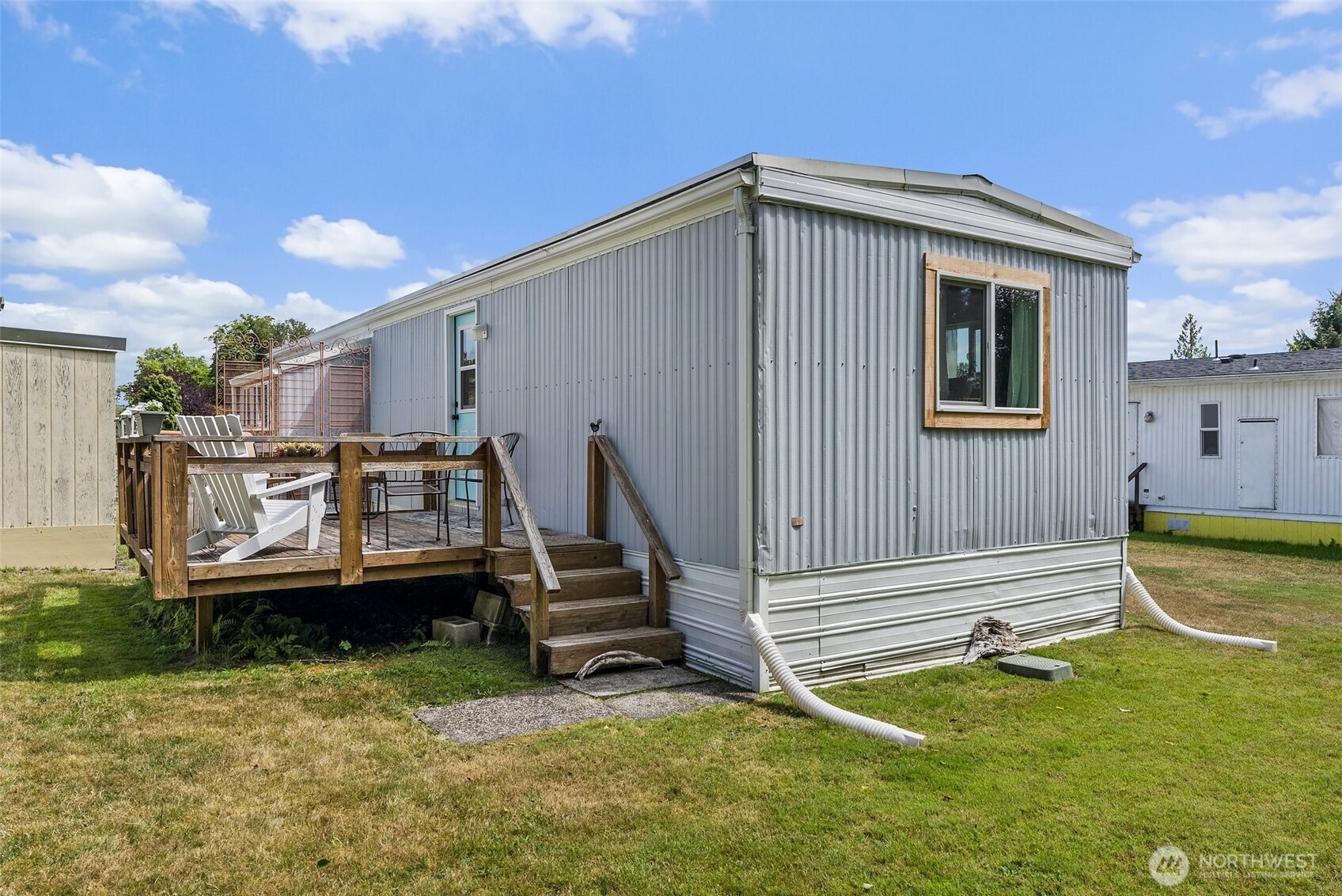 1050 Howard Street, Unit 9 Raymond, WA 98577 - Photo 16 of 20 a view of a house with pool and sitting area