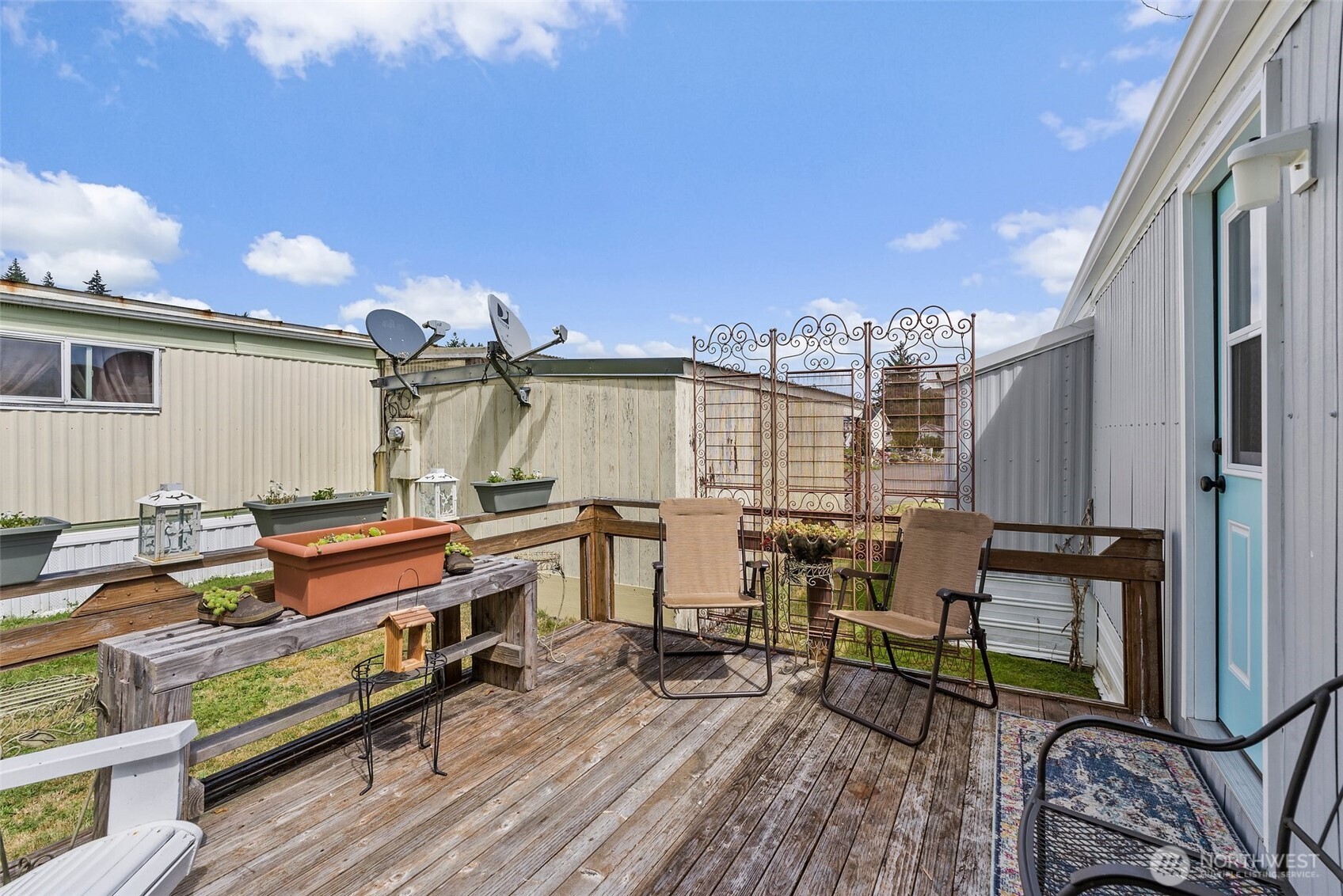 1050 Howard Street, Unit 9 Raymond, WA 98577 - Photo 3 of 20 a view of balcony with chairs and wooden fence