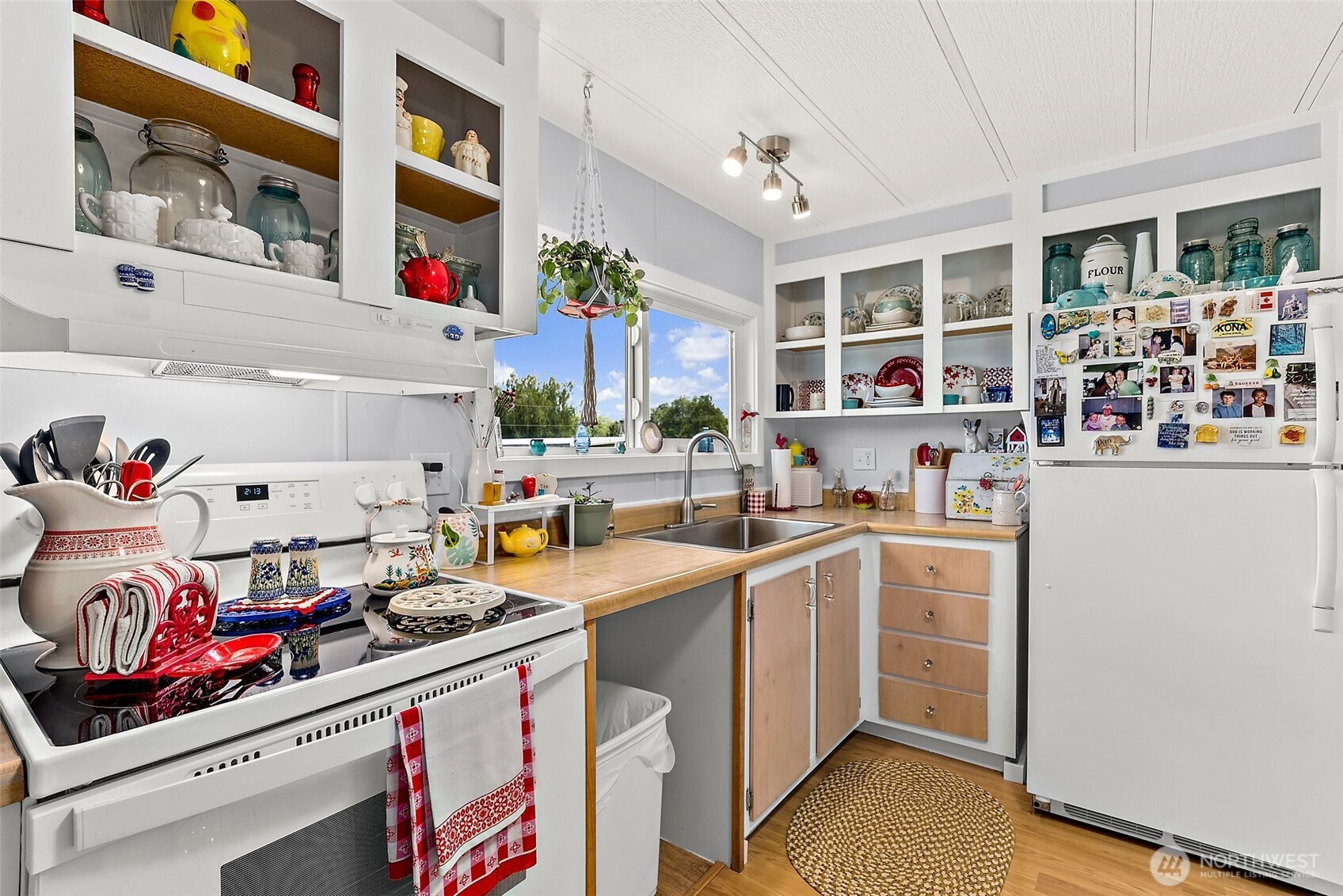 1050 Howard Street, Unit 9 Raymond, WA 98577 - Photo 9 of 20 a kitchen filled with stainless steel appliances a sink and a refrigerator
