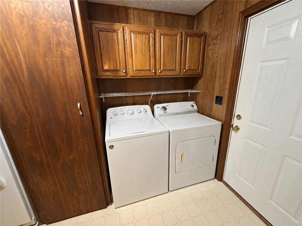 28 Southfork Road Eufaula, AL 36027 - Photo 20 of 20 Wood-paneled walls with overhead cabinetry and a built-in storage unit