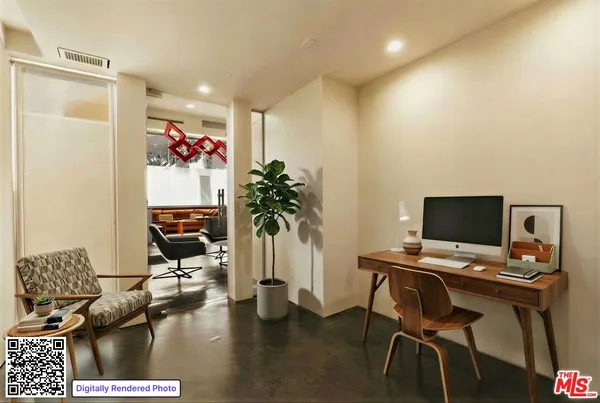 a workspace with furniture and a potted plant